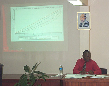 Fred Mumuza moderates the discussion of tax incidence in Uganda